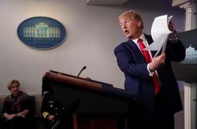 US President Donald Trump holds up a list of coronavirus testing locations that he says US states can use as he addresses the daily coronavirus task force briefing while White House coronavirus coordinator Dr Deborah Birx looks on at the White House in Washington, US, 20 April, 2020 (Photo: Reuters/Jonathan Ernst). US President Donald Trump holds up a list of coronavirus testing locations that he says US states can use as he addresses the daily coronavirus task force briefing while White House coronavirus coordinator Dr Deborah Birx looks on at the White House in Washington, US, 20 April, 2020 (Photo: Reuters/Jonathan Ernst).