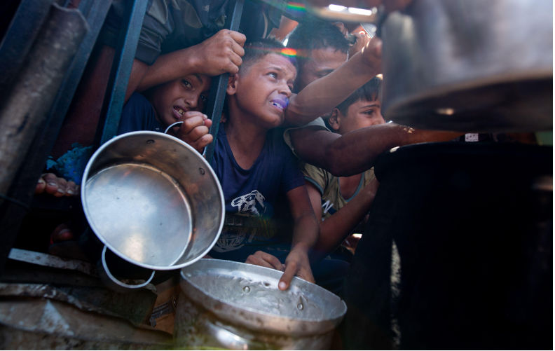 Displaced Palestinians collect donated food. Contributor: jehad alshrafi / Alamy Stock Photo Image ID: 2Y1E2GP In the name of humanity, the barbarism in Gaza must stop