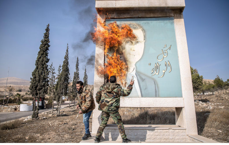 Damascus, Syria. 10th Dec, 2024. A man burns a picture of former Syrian president Bashar al-Assad close to Syria's border with Lebanon. Rebels launched a shock offensive across Syria in late November, ousting President Bashar al-Assad and ending more than half a century of the Assad family regime. (Photo by Sally Hayden/SOPA Images/Sipa USA) Credit: Sipa USA/Alamy Live News Contributor: Sipa USA / Alamy Stock Photo Image ID: 2YW9AJP Beyond sectarian war: How Syrians are betrayed into an undesirable revolution