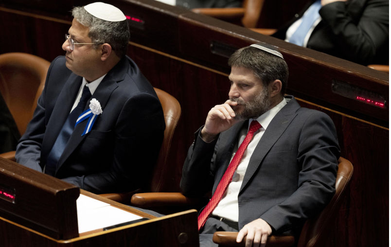 Jerusalem, Israel. 15th Nov, 2022. Far-right Israeli lawmakers Itamar Ben Gvir, center, and Bezalel Smotrich, right, attend the swearing-in ceremony for Israel's government, at the Knesset, or parliament, in Jerusalem, Tuesday, Nov. 15, 2022. Pool Photo by Maya Alleruzzo/ Credit: UPI/Alamy Live News. Contributor: UPI / Alamy Stock Photo Image ID: 2KF1D37 Sanctioning Ben-Gvir and Smotrich is but a tiny, sad step in ending the Gaza massacre