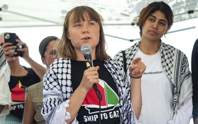 Climate activist Greta Thunberg with other activists from a human rights organization meets with journalists in Catania, Italy, Sunday, June 1, 2025, ahead of their departure for the Mideast. Image: AAP/ AP Photo/Salvatore Cavalli Freedom flotilla sets sail for Gaza carrying aid and demands: 'End the blockade. End the genocide'