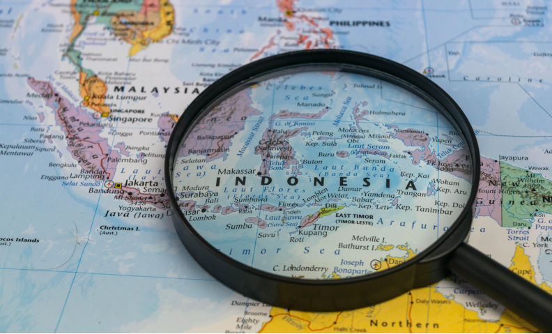 Indonesia map through magnifying glass on a world map. Contributor: wael alreweie / Alamy Stock Photo Image ID: KTFCDP As Keating advised, it's time for Australia to seek its security in Asia