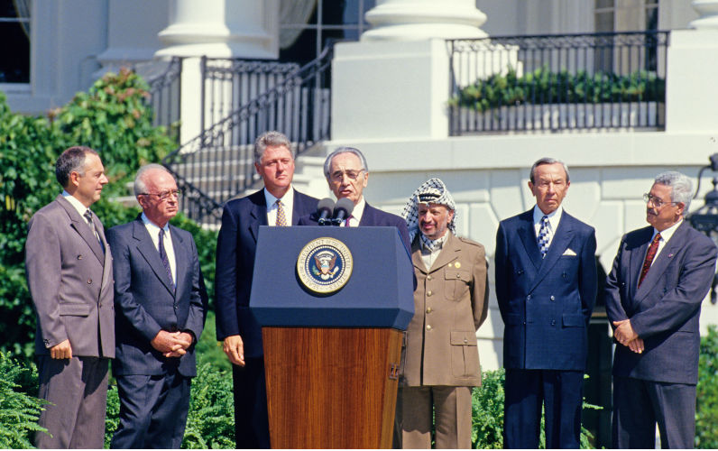 Minister of Foreign Affairs of Israel Shimon Peres makes remarks during the signing ceremony of the historic IsraeliPLO Agreement, known as the Oslo 1 Accord, on the South Lawn of the White House in Washington, DC on September 13, 1993. Pictured, from left to right From left to right are Foreign Minister Andrei Kozyrev of Russia; Prime Minister Yitzhak Rabin of Israel; United States President Bill Clinton; Peres; Chairman Yasser Arafat of the Palestine Liberation Organisation (PLO); US Secretary of State Warren Christopher; and Arafat aide Mahmoud Abbas. Credit Arnie Sachs / CNP. Image Alamy. ContributorNewscom. Image IDJN4WH9 One more betrayal of the Palestinians