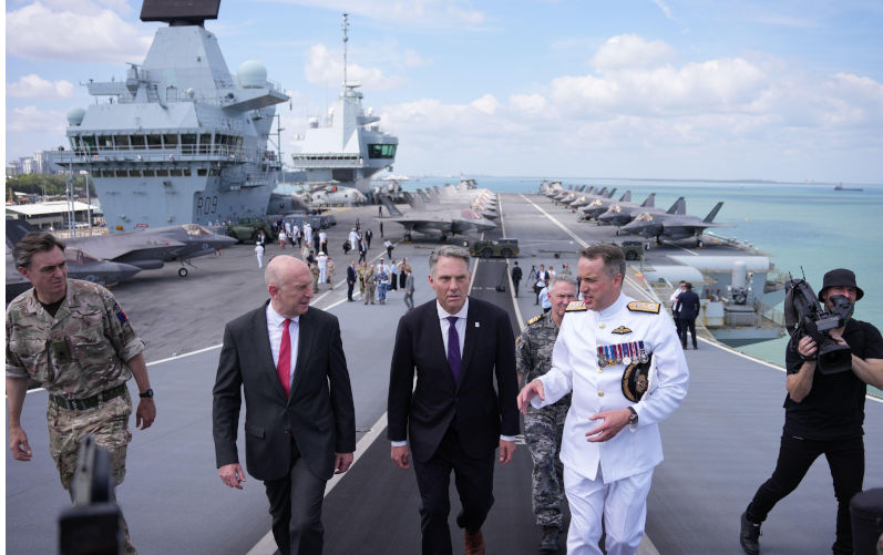 Australia's Deputy Prime Minister and Minister for Defence Richard Marles and Defence Secretary John Healey during a visit to the HMS Prince of Wales aircraft carrier during the Talisman Sabre 2025 Closing Ceremony in Darwin, Australia. Picture date: Sunday July 27, 2025. Image: Alamy. Contributor: PA Images Image ID: 3C3RX0D Britain’s back, China’s the target. We’ll likely pay the price again