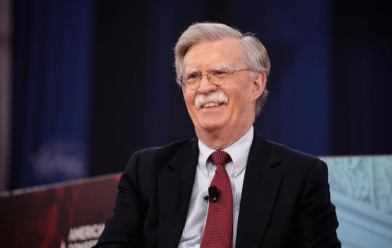 Watch Stella Assange slap the mustache off John Bolton's war criminal face