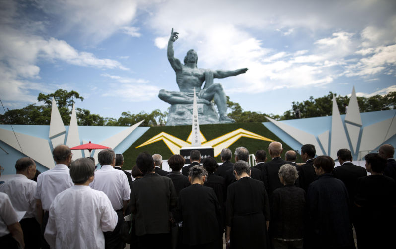 People pray for the atomic bomb victims in front of the Nagasaki Peace Park in Nagasaki, southern Japan, August 9, Japan marked the 71st anniversary of the atomic bombing on Nagasaki. On August 9, 1945, during World War II, the United States dropped the second Atomic bomb on Nagasaki city, killing an estimated 40,000 people which ended World War II.. Image: Alamy. Contributor: NurPhoto SRL Image ID: 2KAJFAH We have turned the Nagasaki 80th into a celebration of Israeli genocide