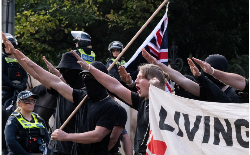Melbourne, Australia, 13 May, 2023. Neo-Nazis salute during a heated political rally against racism, as far-right neo-Nazi groups held a demonstration at state parliament, leading to clashes and scuffles on May 13, 2023 in Melbourne, Australia. Credit: Michael Currie/Speed Media/Alamy Live News. Contributor: Speed Media / Alamy Stock Photo Image ID: 2R1F2TH Why extremists see gold in the migration debate