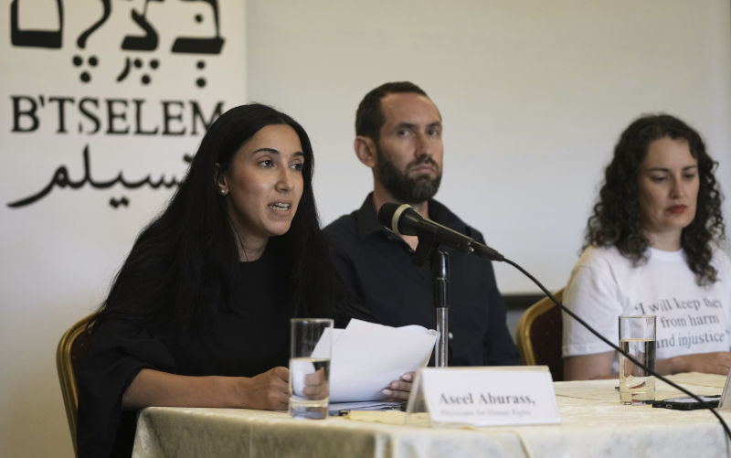 Aseel Aburass, left, of PHRI (Physicians for human Rights Israel) speaks at a press conference with B'Tselem, the Israeli Information Center for Human Rights in the Occupied Territories, releasing a report, 'Our Genocide,' calling the war in Gaza a genocide, and PHRI's legal-medical analysis of the systematic destruction of Gaza's healthcare system, in Jerusalem, Monday, July 28, 2025. Image: AAP/AP/Maya Alleruzzo 'Unequivocal': Israeli human rights orgs describe Gaza assault as 'genocide' for the first time