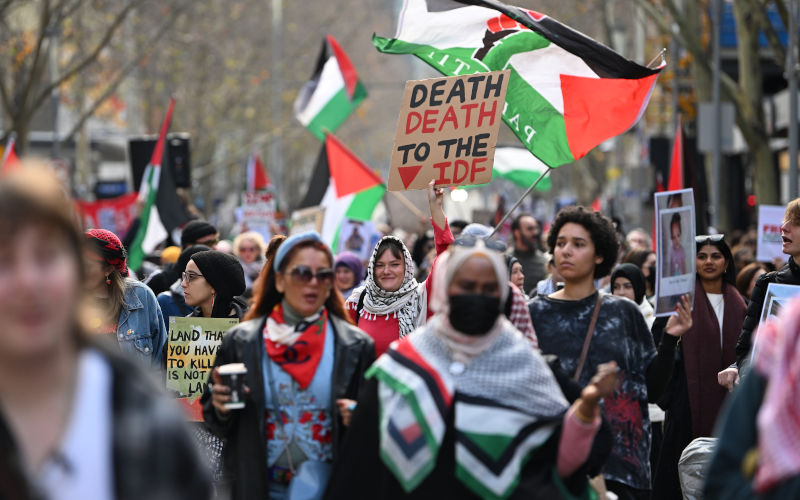 A protester holds up a placard reading 'death death to the IDF' at a march during a Pro-Palestine rally at the State Library of Victoria in Melbourne, Sunday, July 6, 2025. Image: AAP Image/James Ross Freedom of speech and chants
