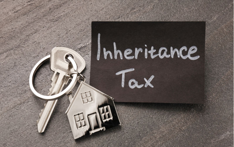 Inheritance Tax. Card and key with key chain in shape of house on grey table, top view. Image: iStock / Liudmila Chernetska Inequality and inheritance taxes