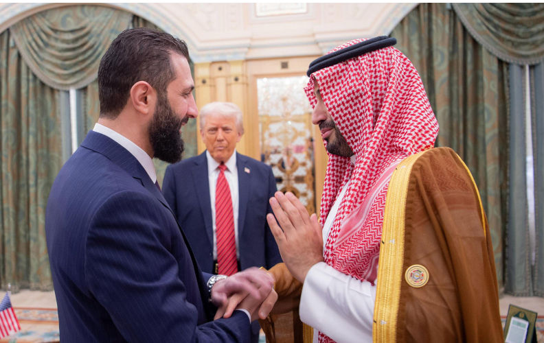 Riyadh, Saudi Arabia. 14th May, 2025. U.S. President Donald Trump, center, looks on as Saudi Crown Prince Mohammed bin Salman, right, shakes hands with Syrian Interim President Ahmed al-Sharaa, left, on Wednesday, May 14, 2025, in Riyadh, Saudi Arabia. Photo by Saudi Ministry of Foreign Affairs/UPI Credit: UPI/Alamy Live News. Contributor: UPI / Alamy Stock Photo Image ID: 3BB1E2D Imperial hypocrisy about 'terrorism' hits its most absurd point yet