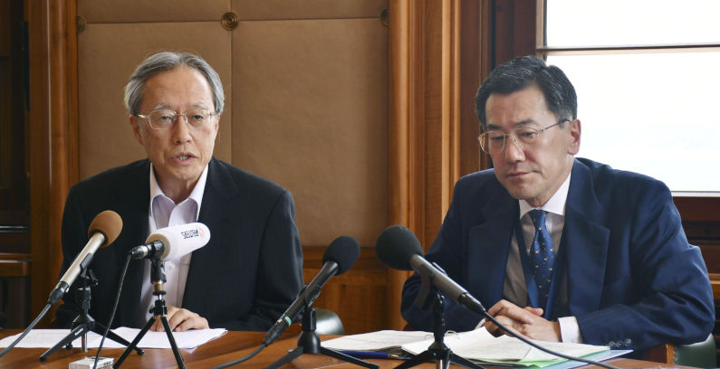 Shingo Yamagami (R), July 24, 2019. The Then head of the Japanese Foreign Ministry's Economic Affairs Bureau, and Junichi Ihara, ambassador of the Permanent Mission of Japan to the International Organisations in Geneva, speak at the World Trade Organisation headquarters in the Swiss city on July 24, 2019. The issue of Japan's tighter controls on exports to South Korea was taken to the WTO. (Kyodo)==Kyodo Photo via Credit: Newscom/Alamy Live News. Contributor: Newscom. Image ID:W4PRXT Ambassador for war crimes denial