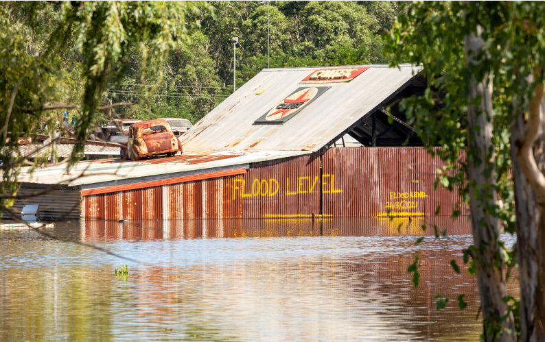 Windsor, NSW, Australia - March 24, 2021; A business affected by flood waters has a hand painted flood level on side of a building indicating the water levels of floods in March 2021.-Image:iStock/lovleah Flood management: Science, technology and people’s responses