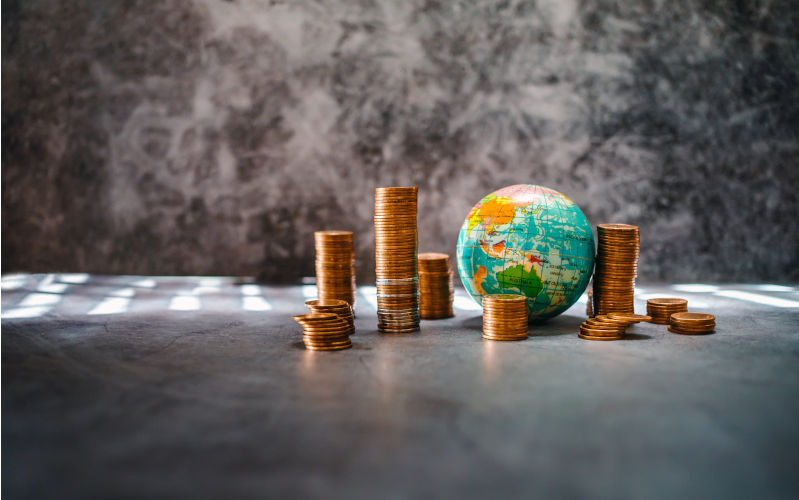 Stack gold coins and Globe. money makes the world go round world financial situation concept.-Image:iStock/Narong-KHUEANKAEW World Bank warns that changes are coming in the global economy