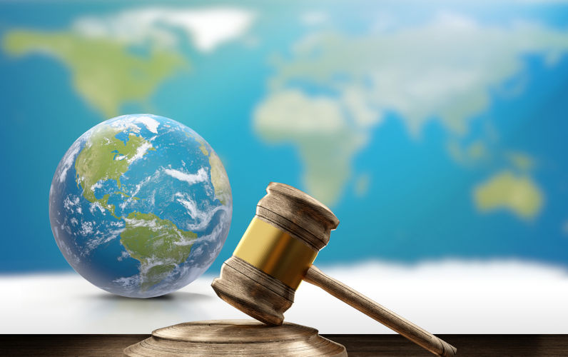 World map planet earth globe and wooden judge gavel 3d-illustration. Elements of this image furnished by NASA. Image: iStock / CrailsheimStudio Why isn’t the UN doing more than talking about Gaza?