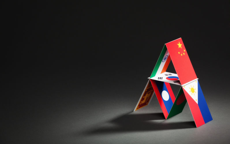 Subject: House of cards made of global economic power nations of the Asian Pacific Trade Agreement APTA. Image: iStock / YinYang Who’s afraid of big, bad China?