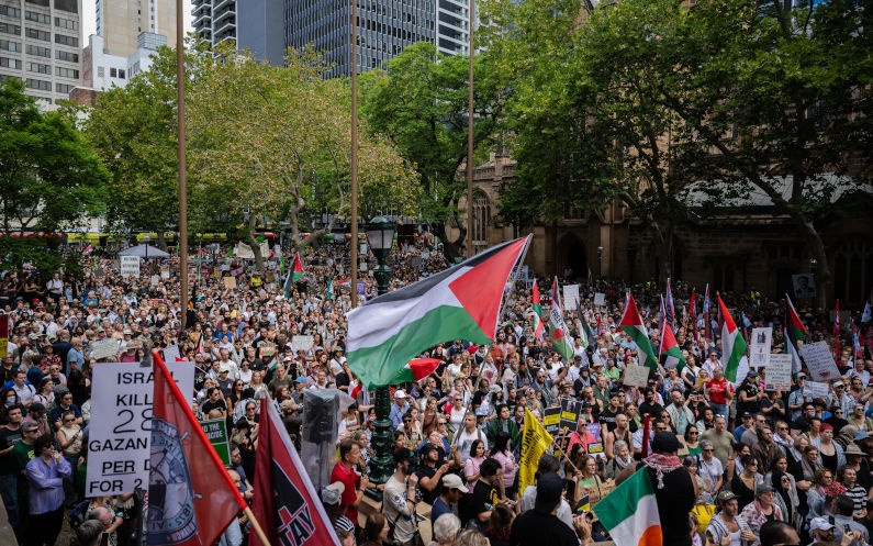 Herzog greeted by mass protest despite limits on marching