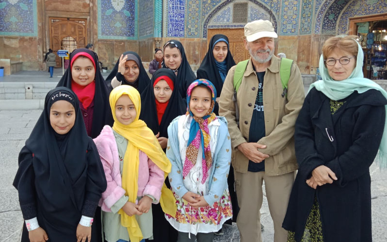 Eugene Doyle and his wife with students in Iran. Image: supplied