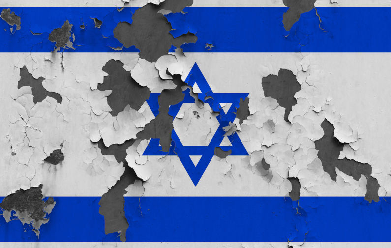 Israel flag close up painted, damaged and dirty on wall peeling off paint to see concrete surface. Vintage National Concept. Image: iStock / sezer ozger Gaza: The day of reckoning is coming