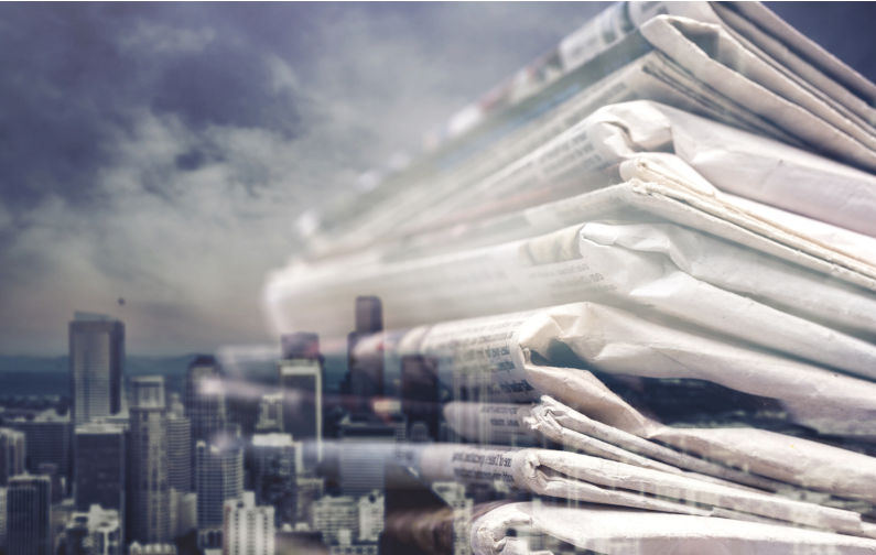 Pile of newspapers on white background Journalism. Image: iStock / artisteer Our media refuse to call out genocide in Gaza