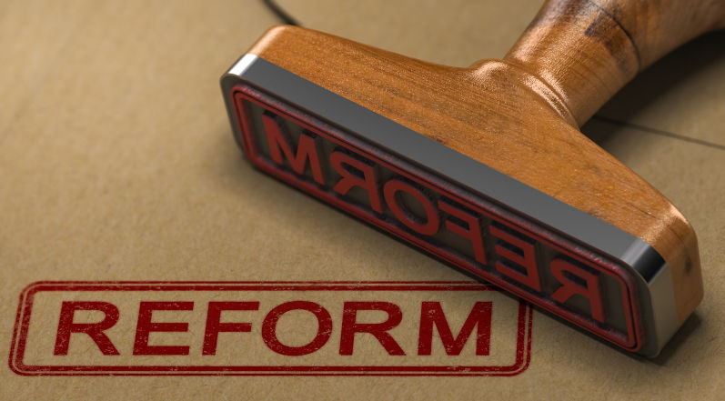3D illustration of a rubber stamp with the word reform stamped on kraft paper envelope. Image: iStock / Olivier Le Moal An economic reform agenda for Labor