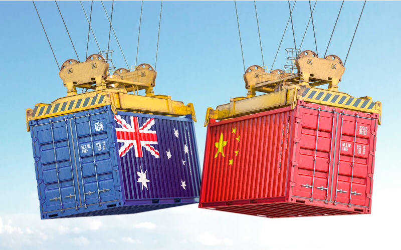 Australia China trade. Cargo shipping containers with flags of Australia and China. 3d illustration. Renewed US-China tensions are trouble for Australia’s economy