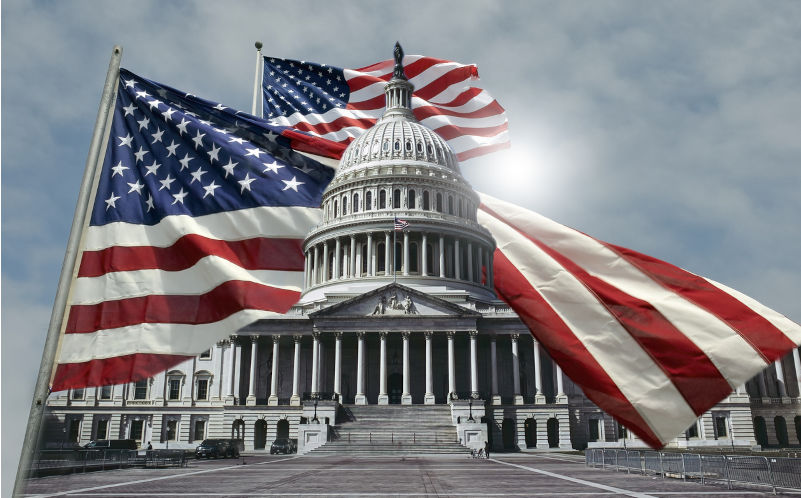 Two Amerncan flags flying that appear to wrap around the U.S. Capitol building in Washington D.C. Image:iStock/alancrosthwaite The end of multilateralism