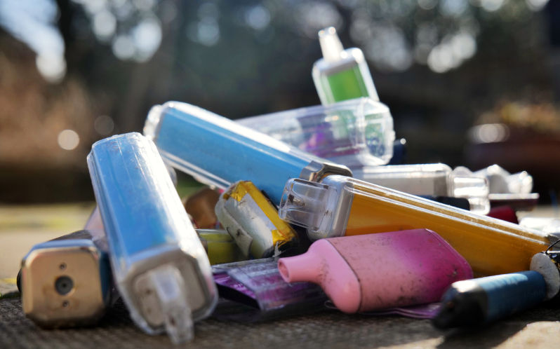 Discarded electronic cigarette vapes that have been collected from roads and pavements shot over a pale concrete slab background. Image iStock / CreditBenjamin Robinson Vaping: A disruptive innovation of smoking and rapidly replacing cigarettes