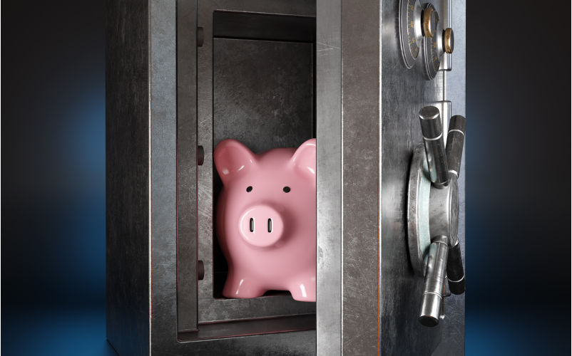 Pink piggy bank in a silver metallic vault safe having a handle wheel on dark background. Illustration of the concept of protection for savings account and financial security. Image iStock / CreditDragon Claws Fatal flaws: what regional Australians need to know about cash plan