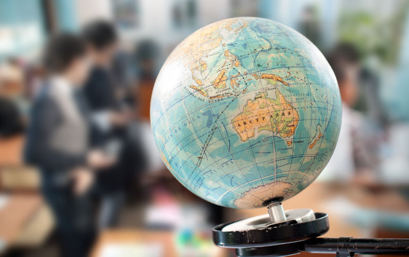 Globe against the background of a school class. Image iStock / CreditGermanovich Islamophobia in Australian schools: What the Special Envoy’s report means for education