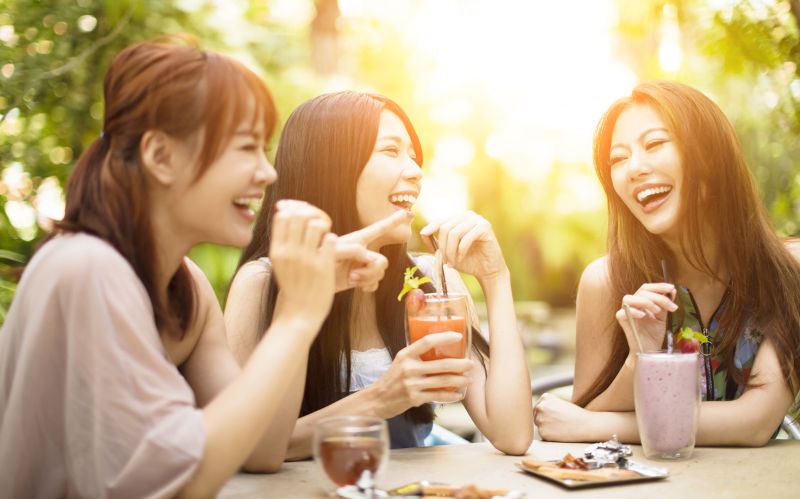 Group of young woman laughing in restaurant. Image iStock / CreditTomwang112 After decades of struggle, women in China are rewriting their future