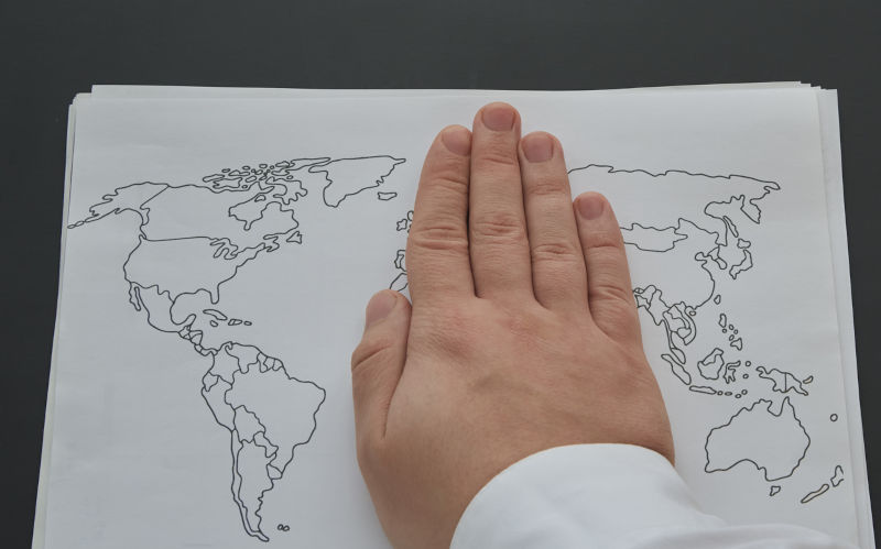 A man's hand covers half of a hand-drawn world map on a white piece of paper. Imperialism, geopolitics and globalisation, conflicts and diplomacy. Image: iStock / Oleksandr Lanevskyi The greatest irony in our contemporary history