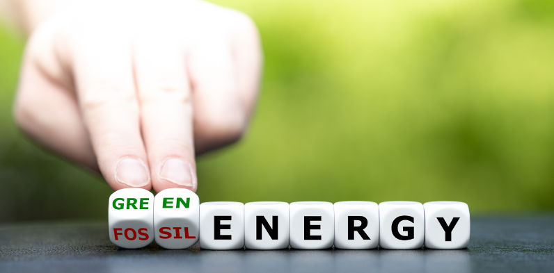 Hand turns dice and changes the expression 'fossil energy' to 'green energy'. Image: iStock / Fokusiert 'A big deal': Bowen says hosting COP31 will lift Australia’s standing and help accelerate renewables shift