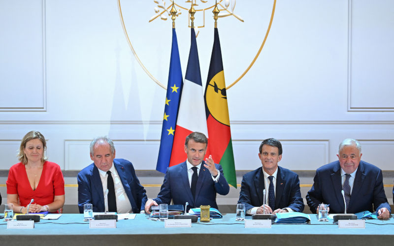 President of the French National Assembly Yael Braun-Pivet, French Prime Minister Francois Bayrou, French President Emmanuel Macron, French Minister of Overseas Manuel Valls, President of the French Senate Gerard Larcher and Private secretary of the French President Patrice Faure at a meeting with all the territory's political players and representatives of New Caledonian civil society at the Palais de L'ElysÃ(c)e on the occasion of the opening of the summit for the future of New Caledonia on July 2, 2025 in Paris. Image: AAP/Tomas Stevens/ABACAPRESS.COM. Political unrest, French negotiations and decolonisation in New Caledonia