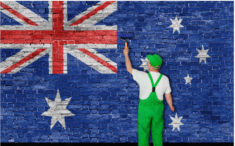 Australian flag painted over old brick wall by house painter. Image: iStock / thumb Mental health of workers undermined in New South Wales