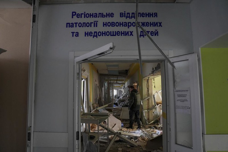 A volunteer worker in the damaged Mariupole maternity hospital, 9 March 2022