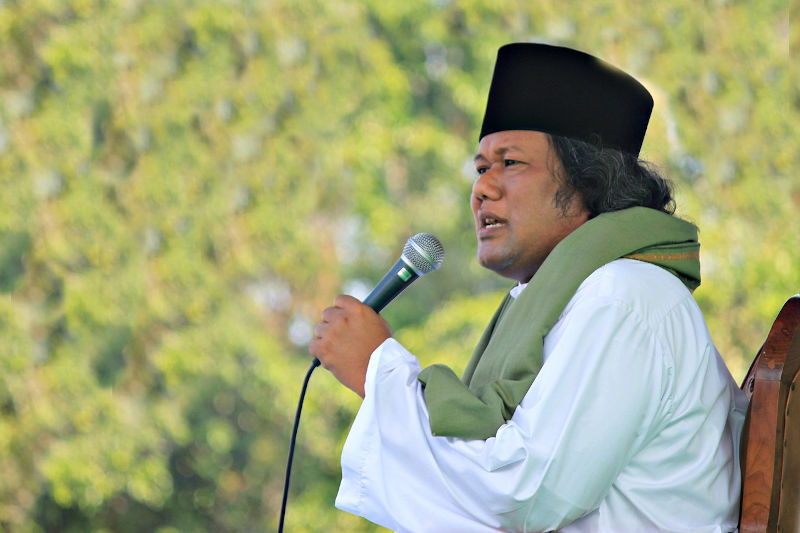 Indonesian muslim with microphone