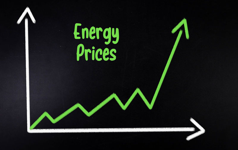 Graph of energy prices on black chalk board.