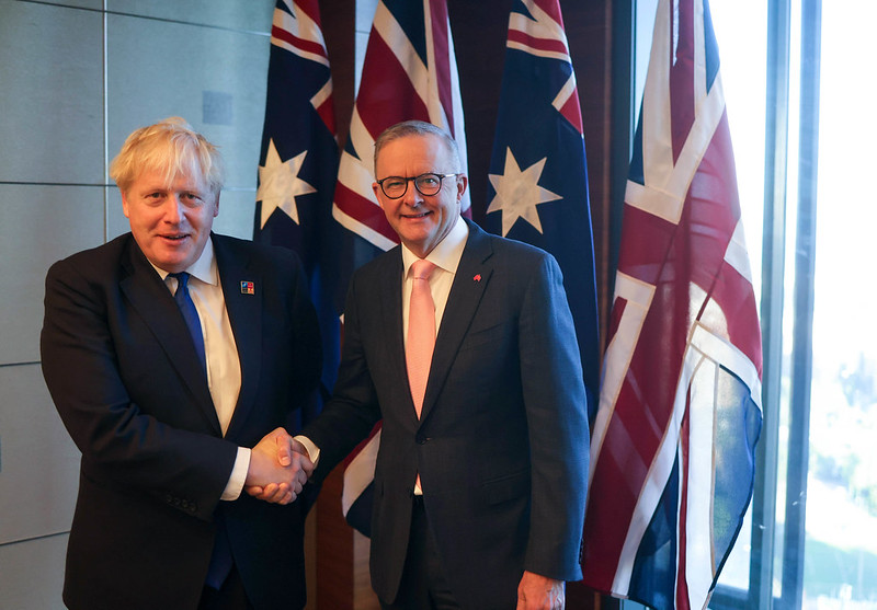 Prime Minister Albanese shakes hands with British PM Boris Johnson in Madrid 20 June 2022