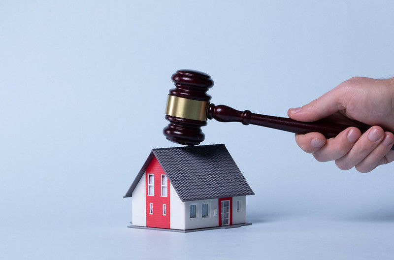 Judge gavel over a house