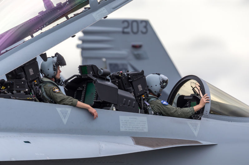 Royal Australian Air Force Aircrew in a Boeing F/A-18F aircraft while it taxis at Avalon Airport.