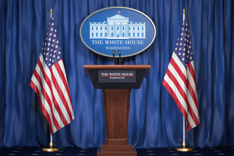 Briefing of president of US United States in White House. Podium speaker tribune with USA flags and sign of White Houise. Politics concept