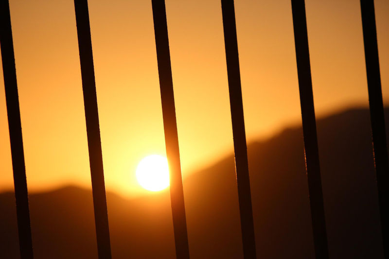 Sunset from behind bars