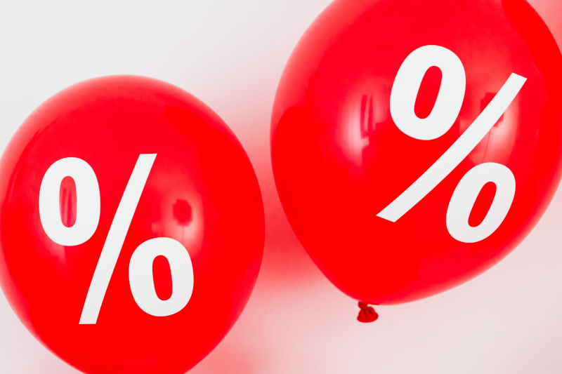 Two Red Balloons With Percentage Symbols