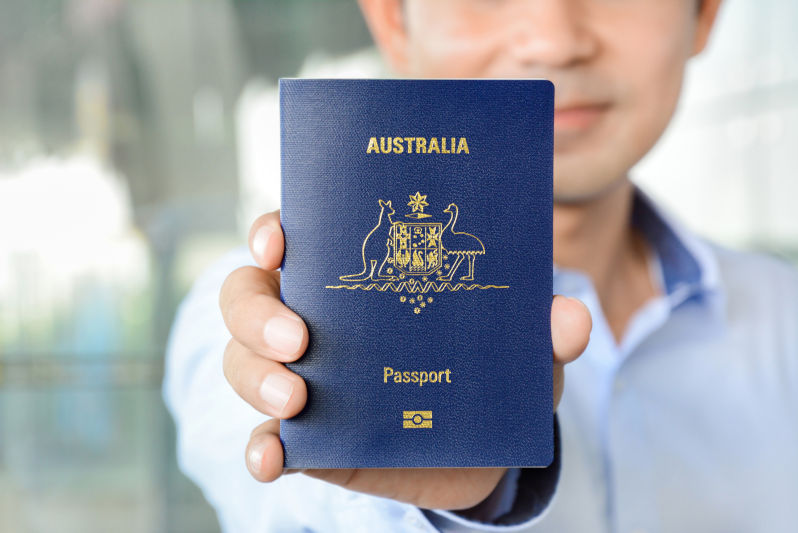 A man showing passport (of Australia)