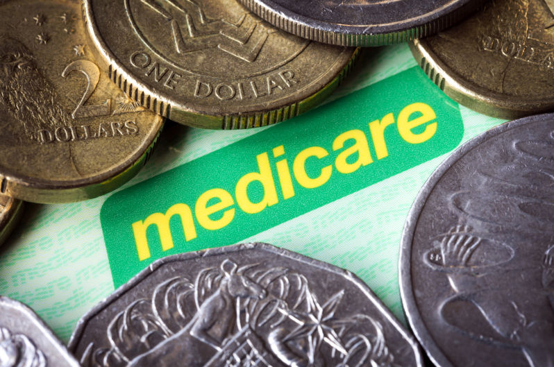 Australian Medicare card and money.