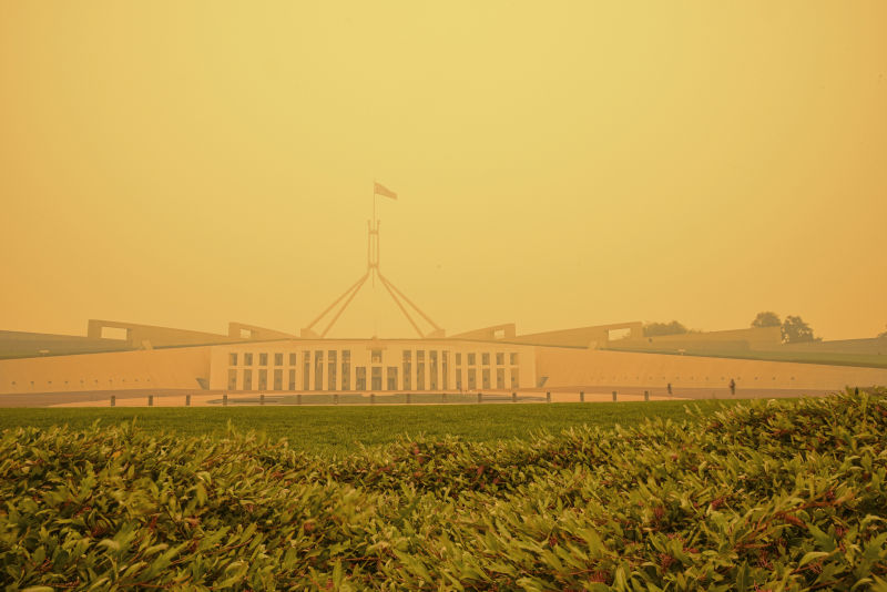 Canberra, Australia, 5/01/2020, Smoke coming from nearby forest fires creates high pollution and covers Canberra with a thick fog. People need to wear mask to breathe.