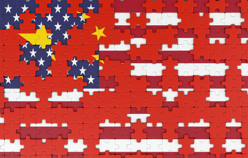 Chinese flag building over the USA flag in a jigsaw puzzle