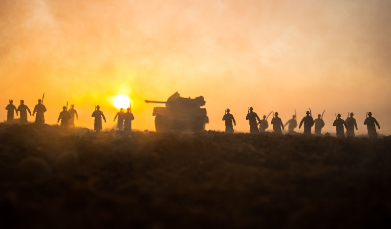 Military silhouettes fighting scene on war fog sky background