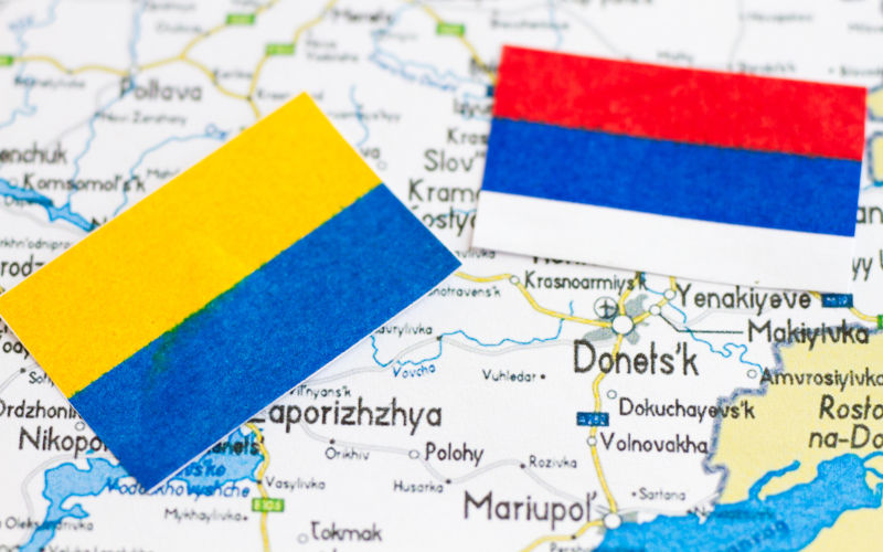 Ukraine map and donots is marking with Ukraine and Russia flags.